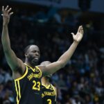 Mar 29, 2024; Charlotte, North Carolina, USA; Golden State Warriors forward Draymond Green (23) reacts after being charged with a foul in the second half as the Warriors play against the Charlotte Hornets at Spectrum Center. Mandatory Credit: Nell Redmond-USA TODAY Sports