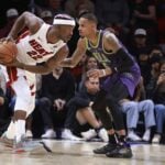 New Orleans Pelicans point guard Dejounte Murray defends Miami Heat forward Jimmy Butler