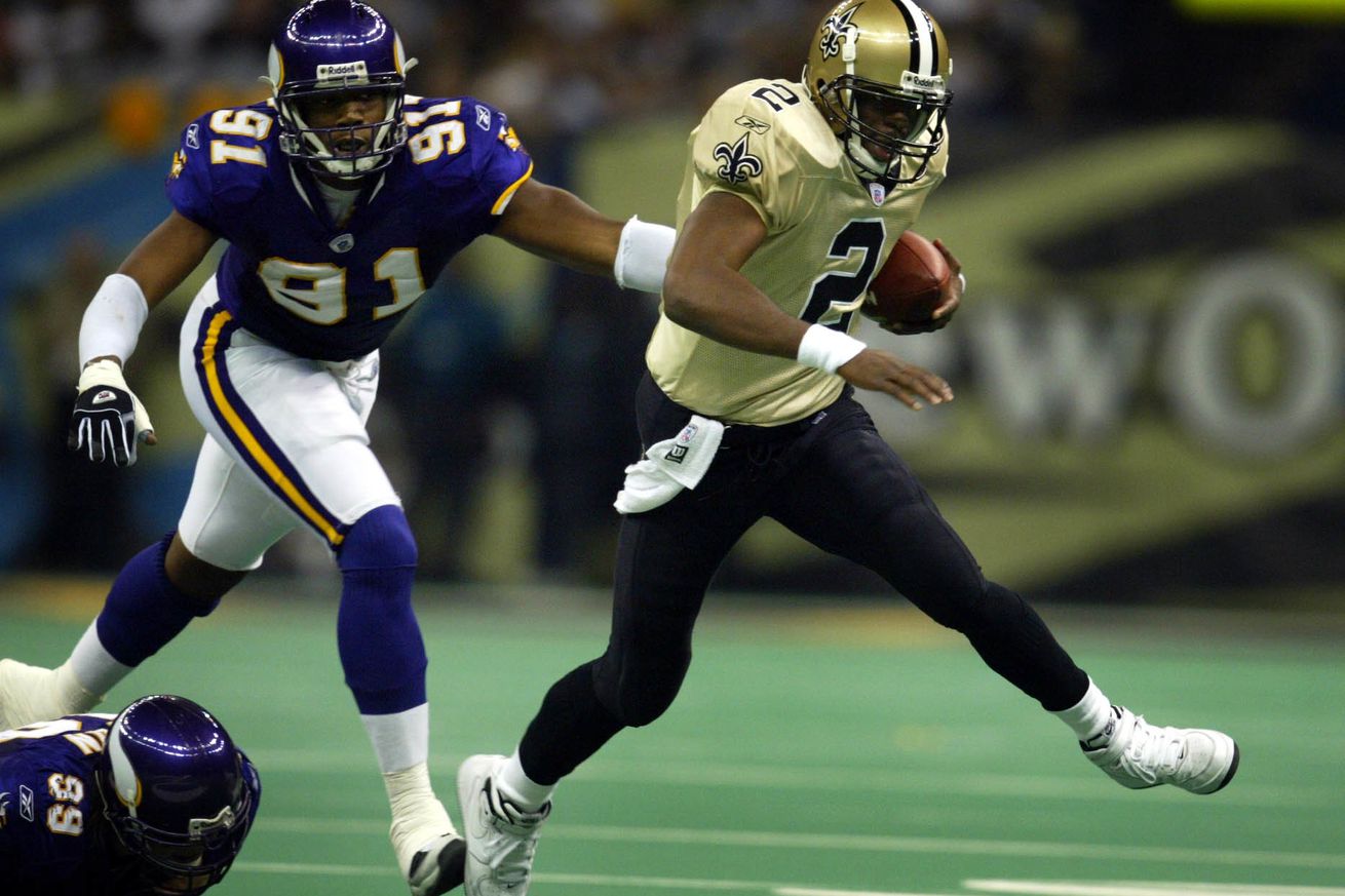 New Orleans LA, 12/15/02 Vikings at Saints----- Vikings Larenzo Bromell (91) chased Saints quarteback Aaron Brooks out of the pocket in the 2nd quarte during Sunday game at the Superdome in New Orleans