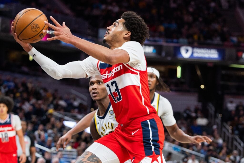 Apr 8, 2025; Indianapolis, Indiana, USA; Washington Wizards guard Jordan Poole (13) shoots the ball while Indiana Pacers guard Bennedict Mathurin (00) defends in the second half at Gainbridge Fieldhouse. Mandatory Credit: Trevor Ruszkowski-Imagn Images
